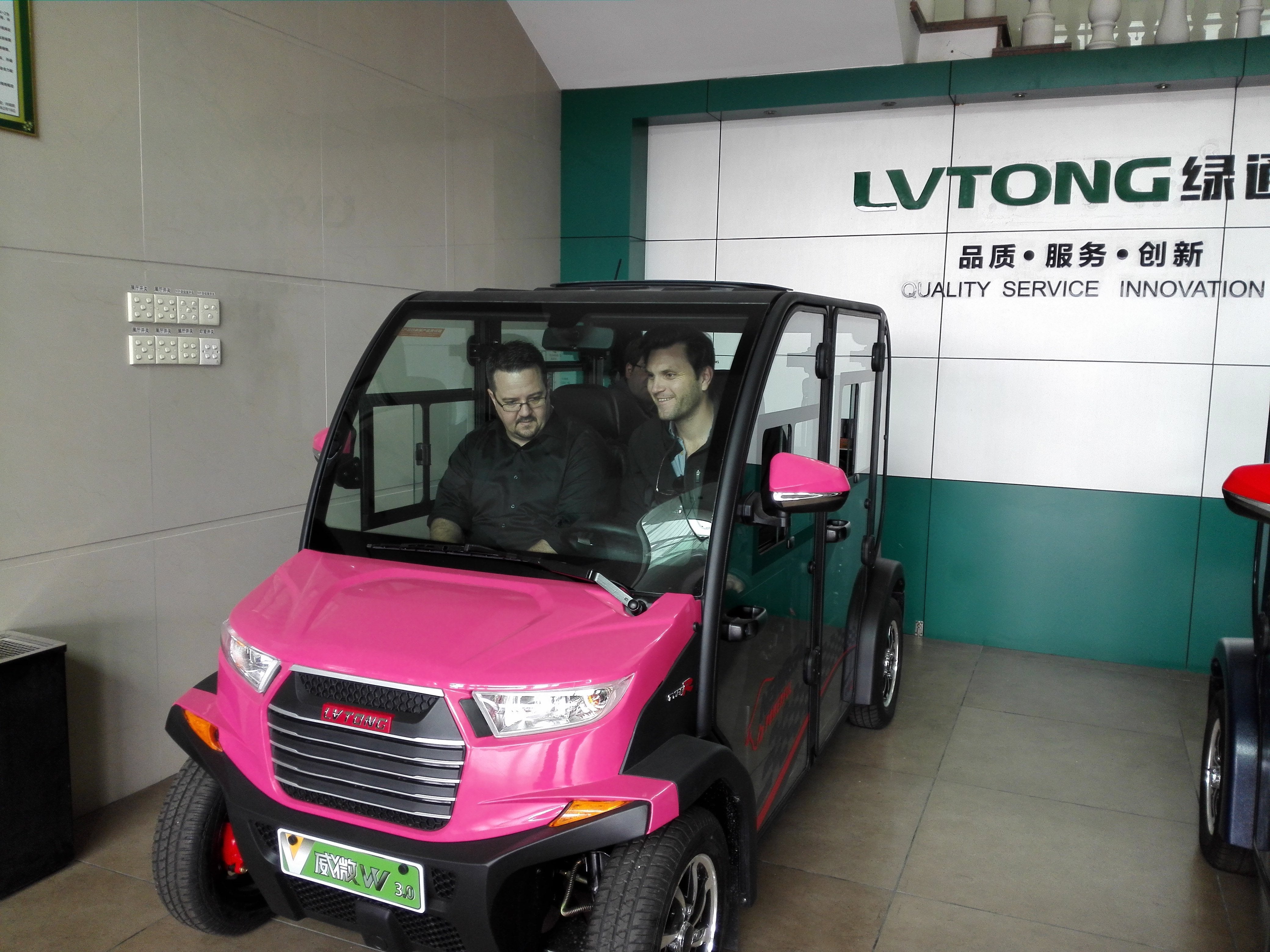 Purple ECAR 4 Seat LT-S4.DB Community Electric Cart with passengers inside